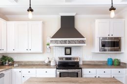 The SOUTHERN CHARM 4 BR Kitchen. This Manufactured Mobile Home features 4 bedrooms and 2 baths.
