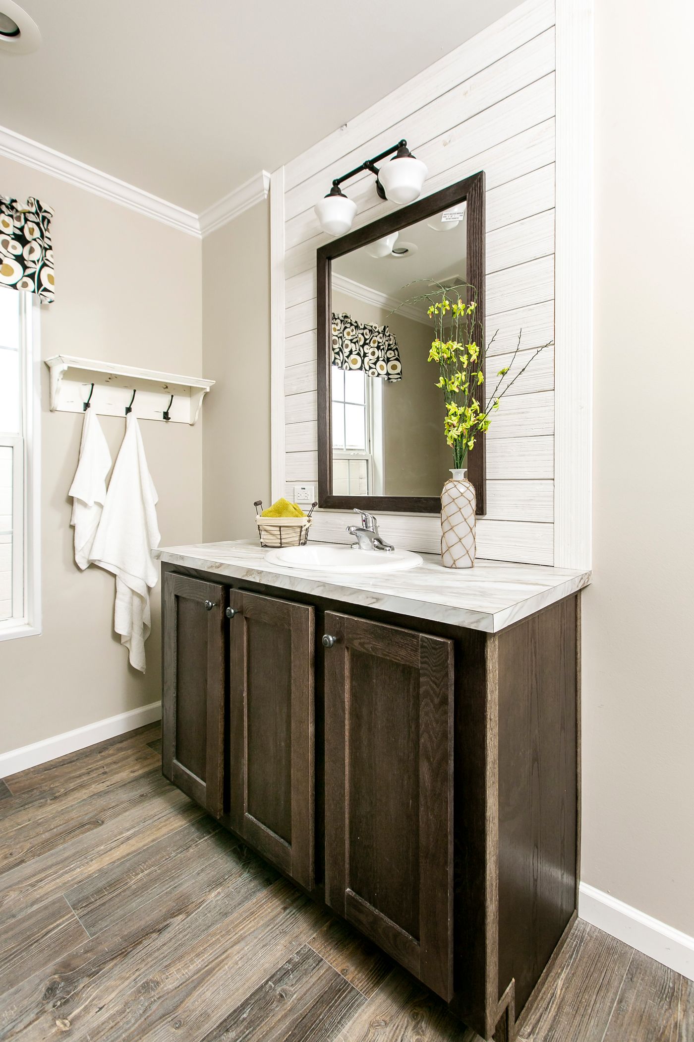 The FREEDOM FARM HOUSE  32X60 Guest Bathroom. This Manufactured Mobile Home features 3 bedrooms and 2 baths.