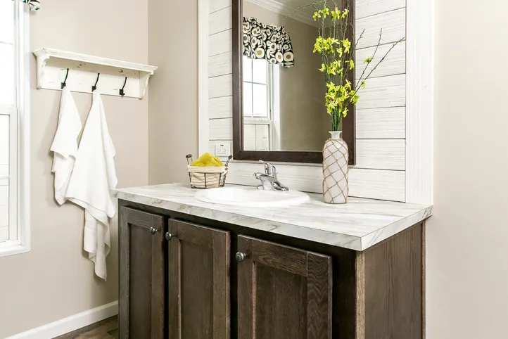 The FREEDOM FARM HOUSE  32X60 Guest Bathroom. This Manufactured Mobile Home features 3 bedrooms and 2 baths.
