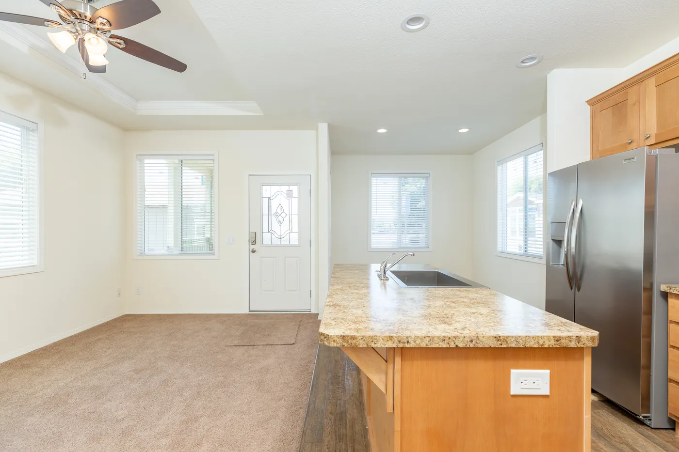 The FAIRPOINT 20523B Living Room. This Manufactured Mobile Home features 3 bedrooms and 2 baths.