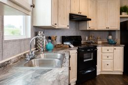 The FRONTIER Kitchen. This Manufactured Mobile Home features 2 bedrooms and 2 baths.