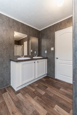The TRADITION 56D Guest Bathroom. This Manufactured Mobile Home features 3 bedrooms and 2 baths.