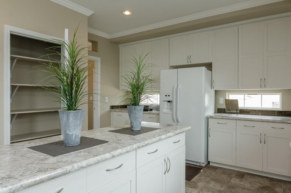 The TRANQUILITY TR3062A Kitchen. This Manufactured Mobile Home features 3 bedrooms and 2 baths.