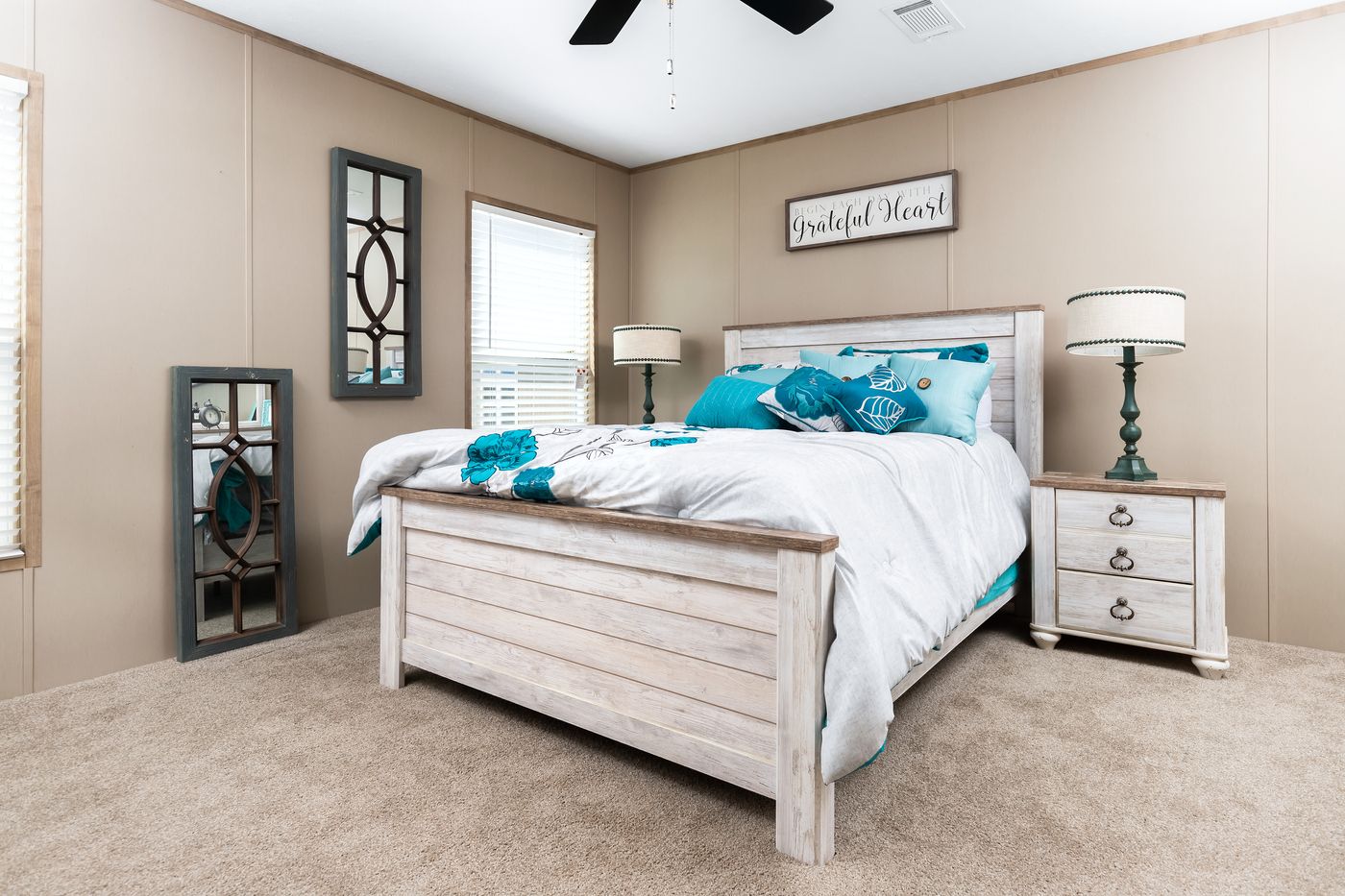 The FARMHOUSE FLEX Primary Bedroom. This Manufactured Mobile Home features 3 bedrooms and 2.5 baths.