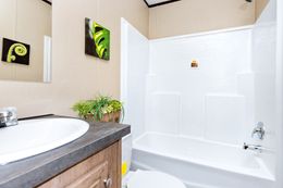 The THE SHERMAN Guest Bathroom. This Manufactured Mobile Home features 3 bedrooms and 2 baths.
