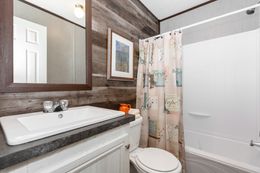 The THE GRANITE RIDGE Guest Bathroom. This Manufactured Mobile Home features 3 bedrooms and 2 baths.
