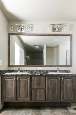The 2022 COLUMBIA RIVER Primary Bathroom. This Manufactured Mobile Home features 3 bedrooms and 2 baths.
