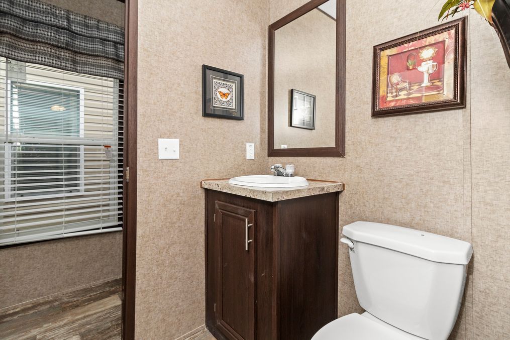 The THE PARKSIDE Guest Bathroom. This Manufactured Mobile Home features 3 bedrooms and 2 baths.