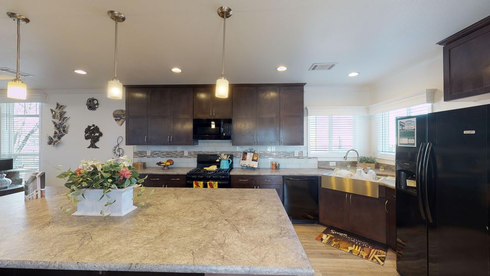 The SUM3068A Kitchen. This Manufactured Mobile Home features 3 bedrooms and 2 baths.