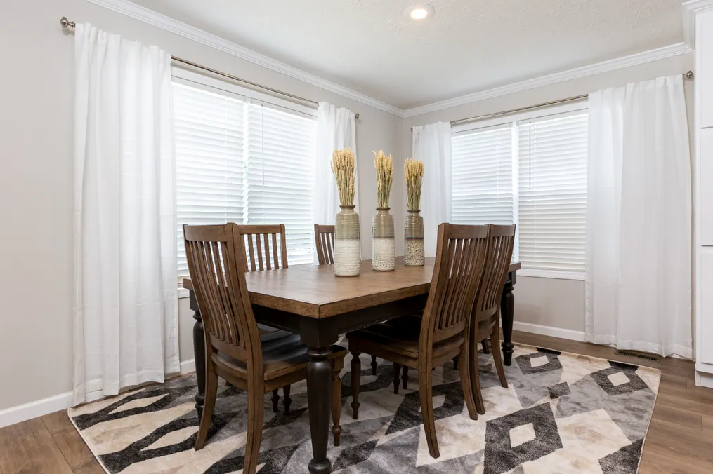 The KEENELAND Dining Area. This Manufactured Mobile Home features 3 bedrooms and 2 baths.