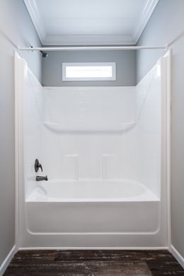 The THE TEAGAN Guest Bathroom. This Manufactured Mobile Home features 4 bedrooms and 3 baths.