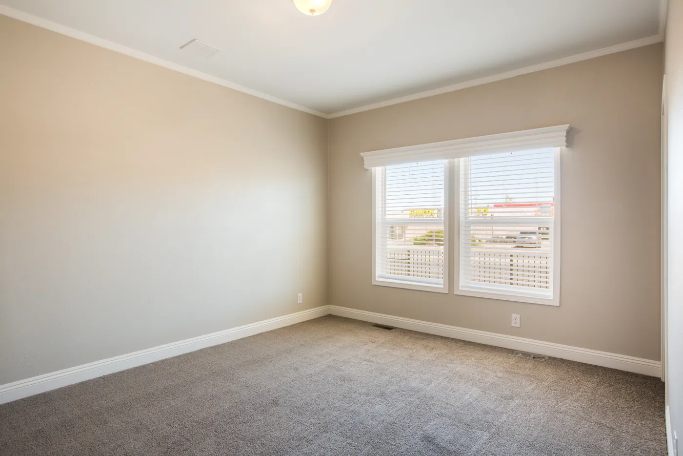 The EDGEWOOD Guest Bedroom. This Manufactured Mobile Home features 3 bedrooms and 2 baths.