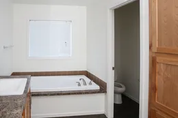 The INDIGO Primary Bathroom. This Manufactured Mobile Home features 3 bedrooms and 2 baths.