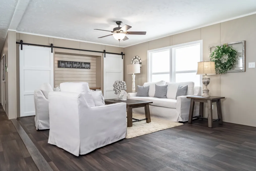 The THE RESERVE 60 Living Room. This Manufactured Mobile Home features 3 bedrooms and 2 baths.