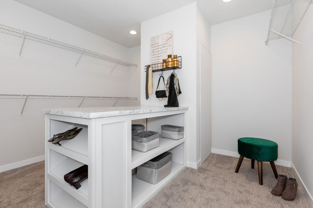 The TAYLOR 6430-9062 SECT Primary Bedroom. This Manufactured Mobile Home features 3 bedrooms and 2 baths.