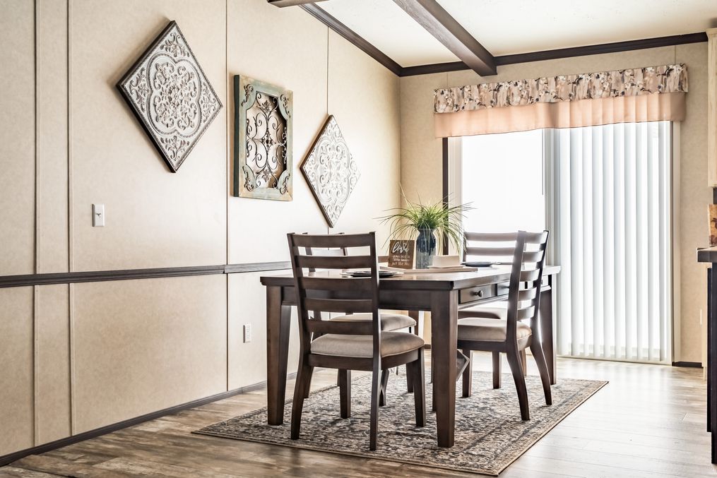 The THE TYRA Dining Area. This Manufactured Mobile Home features 4 bedrooms and 2 baths.