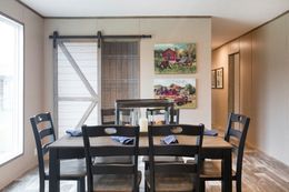 The THE CREEKWOOD Dining Area. This Manufactured Mobile Home features 4 bedrooms and 2 baths.