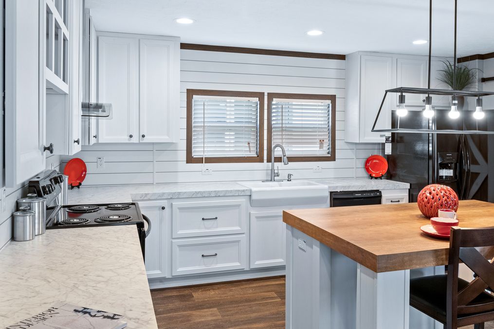 The BREEZE FARMHOUSE Kitchen. This Manufactured Mobile Home features 3 bedrooms and 2 baths.