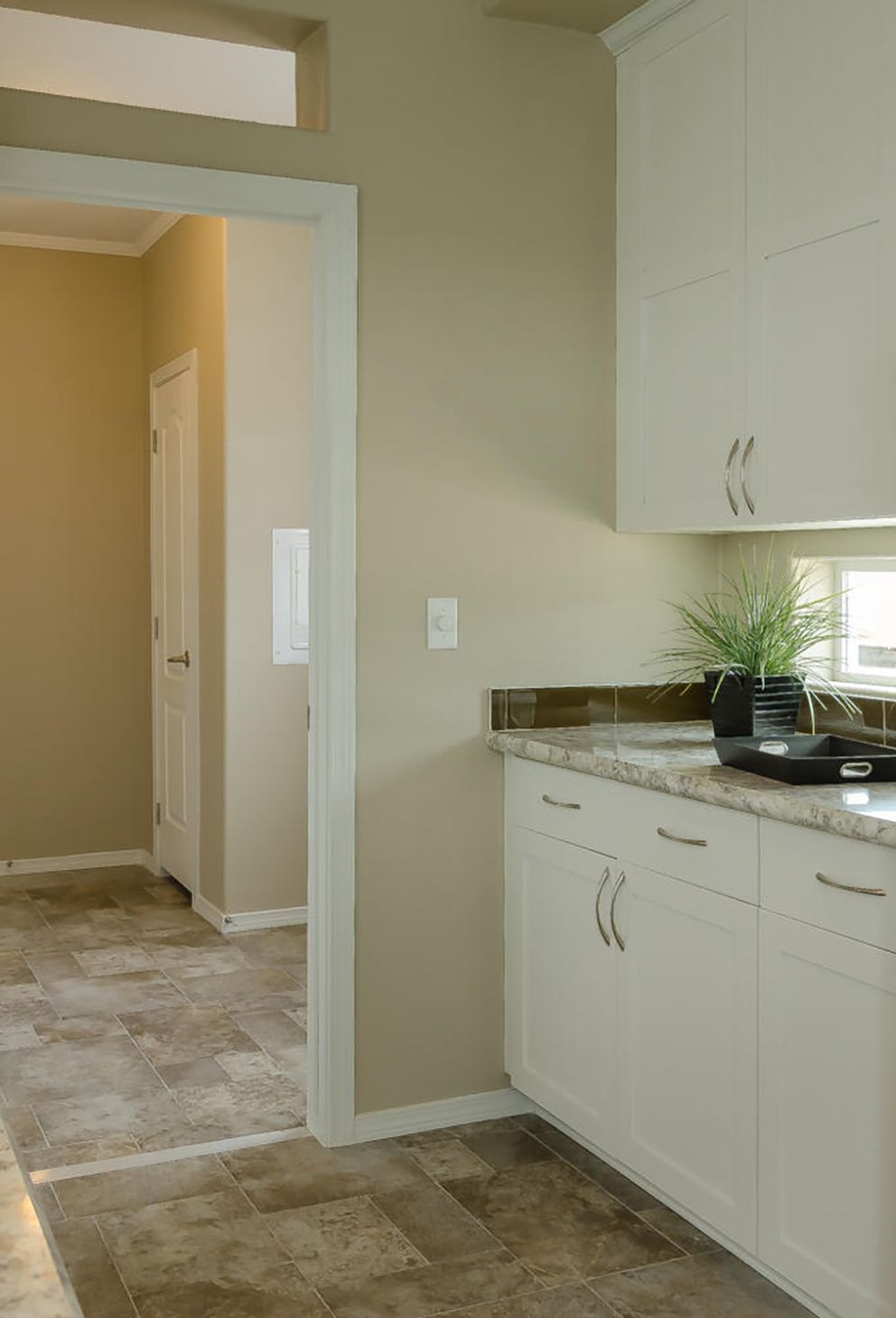 The TRANQUILITY TR3062A Kitchen. This Manufactured Mobile Home features 3 bedrooms and 2 baths.