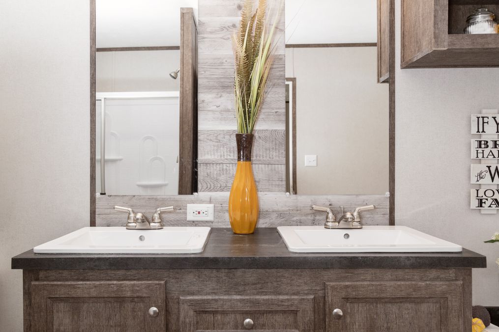 The THE ANNIVERSARY 76 Primary Bathroom. This Manufactured Mobile Home features 3 bedrooms and 2 baths.