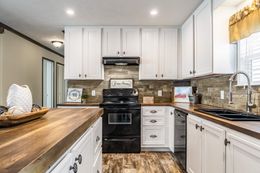 The THE STARK Kitchen. This Manufactured Mobile Home features 3 bedrooms and 2 baths.