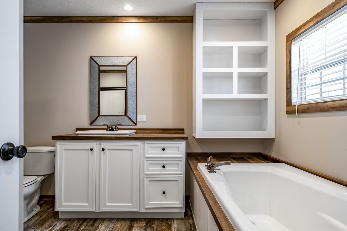 The THE BOBBY JO Master Bathroom. This Manufactured Mobile Home features 3 bedrooms and 2 baths.