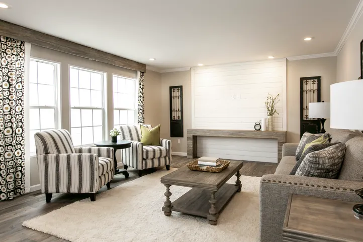 The FREEDOM FARM HOUSE  32X60 Living Room. This Manufactured Mobile Home features 3 bedrooms and 2 baths.