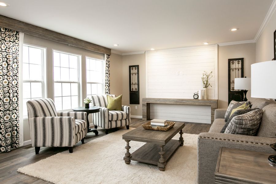 The FREEDOM FARM HOUSE  32X60 Living Room. This Manufactured Mobile Home features 3 bedrooms and 2 baths.