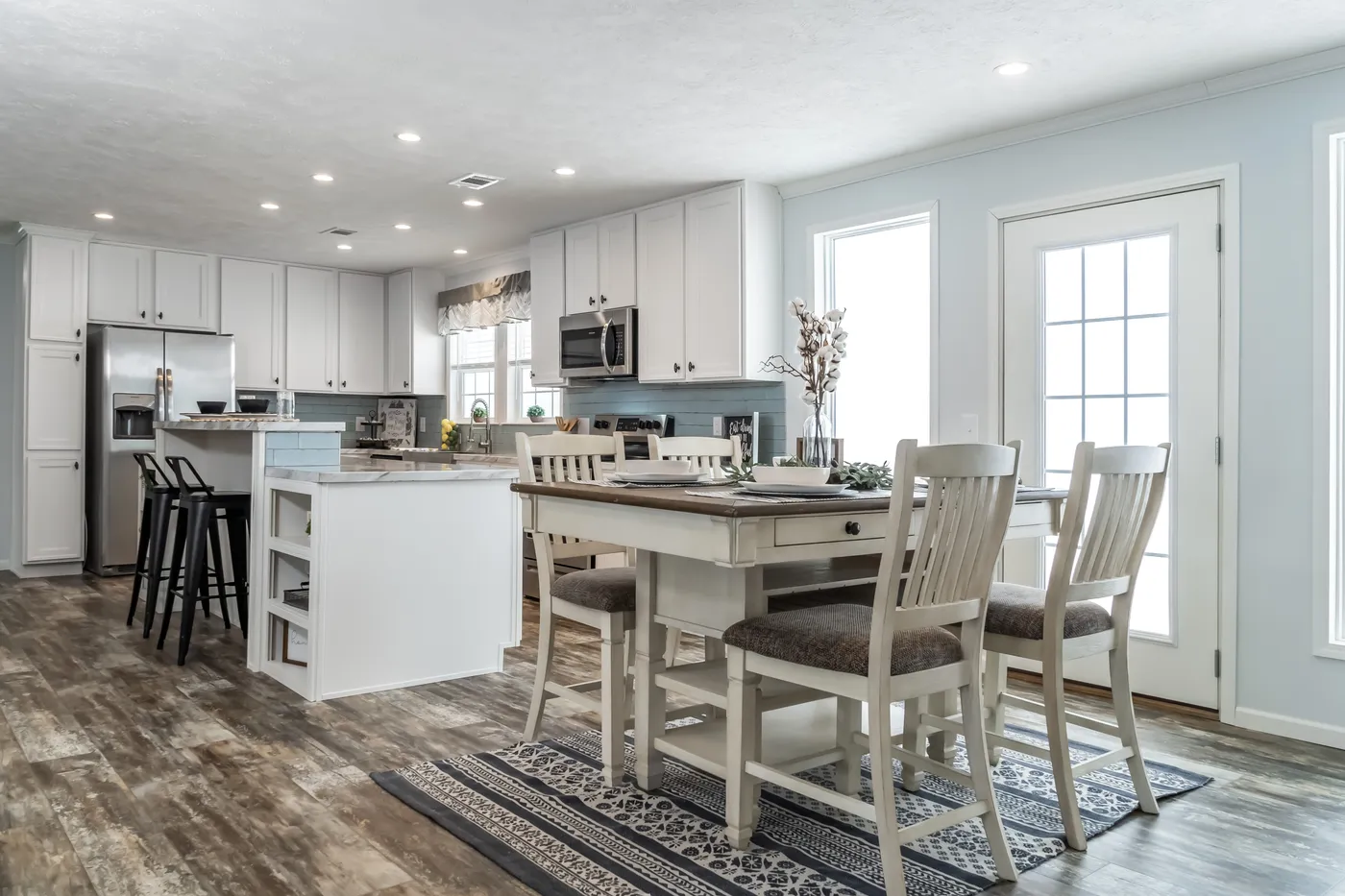 The THE LEAHY Dining Area. This Manufactured Mobile Home features 4 bedrooms and 2 baths.