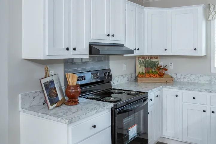 The THE FREEDOM BREEZE Kitchen. This Manufactured Mobile Home features 3 bedrooms and 2 baths.