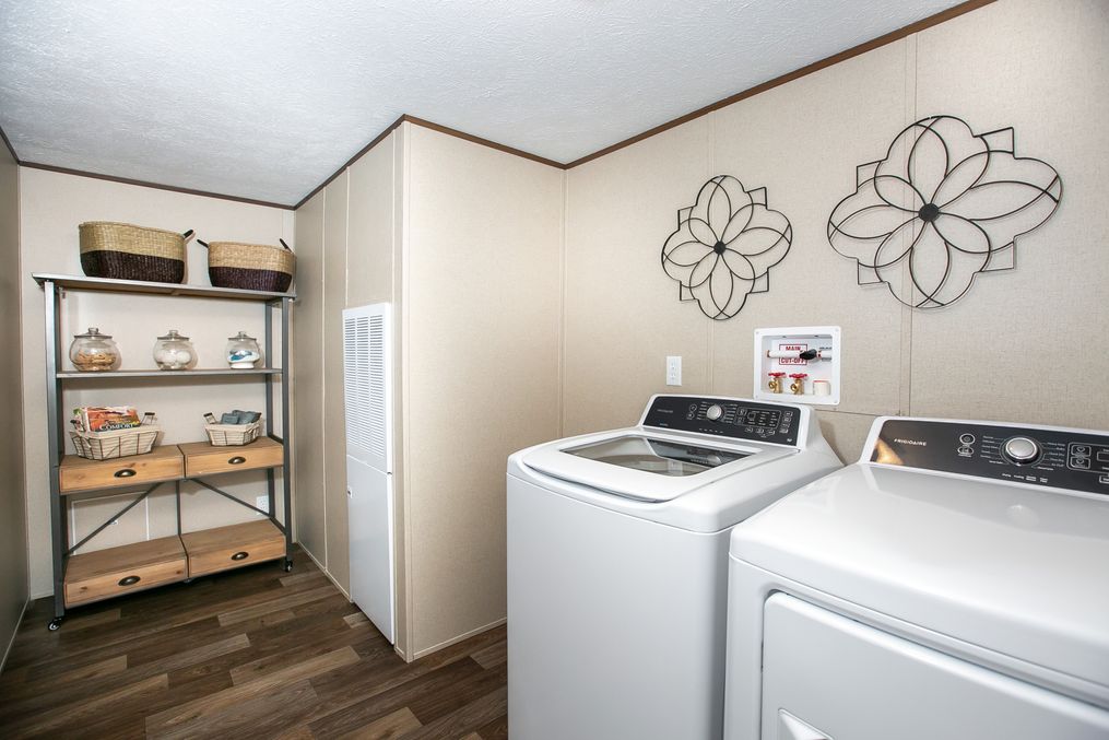 The TRIUMPH Utility Room. This Manufactured Mobile Home features 5 bedrooms and 3 baths.