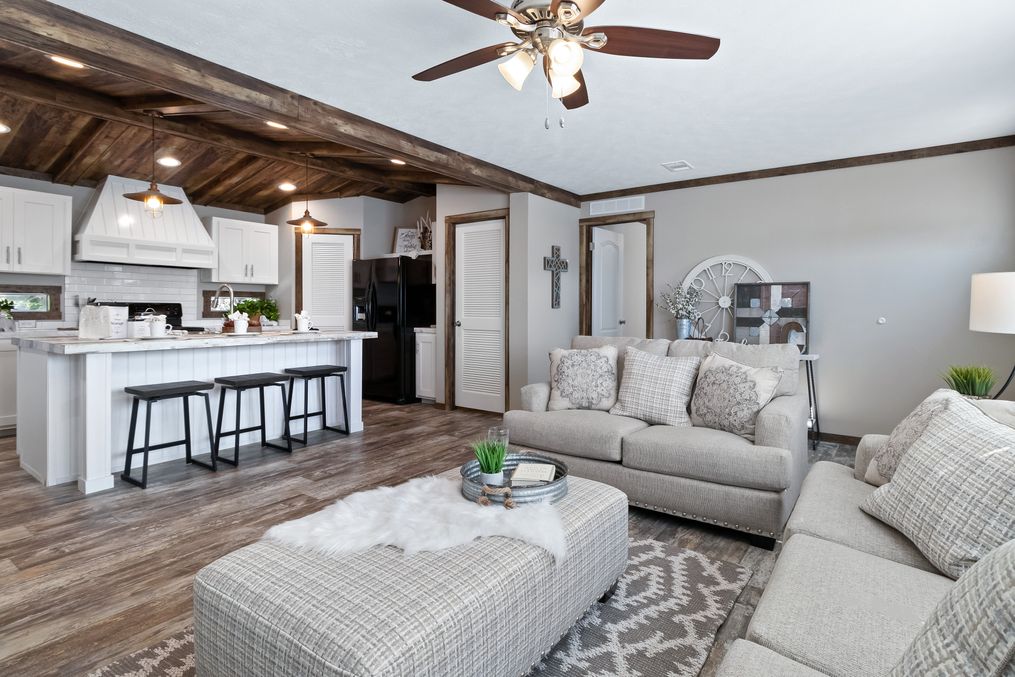 The THE MAVERICK Living Room. This Manufactured Mobile Home features 4 bedrooms and 2 baths.