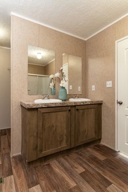 The THE EAGLE 60 Guest Bathroom. This Manufactured Mobile Home features 3 bedrooms and 2 baths.