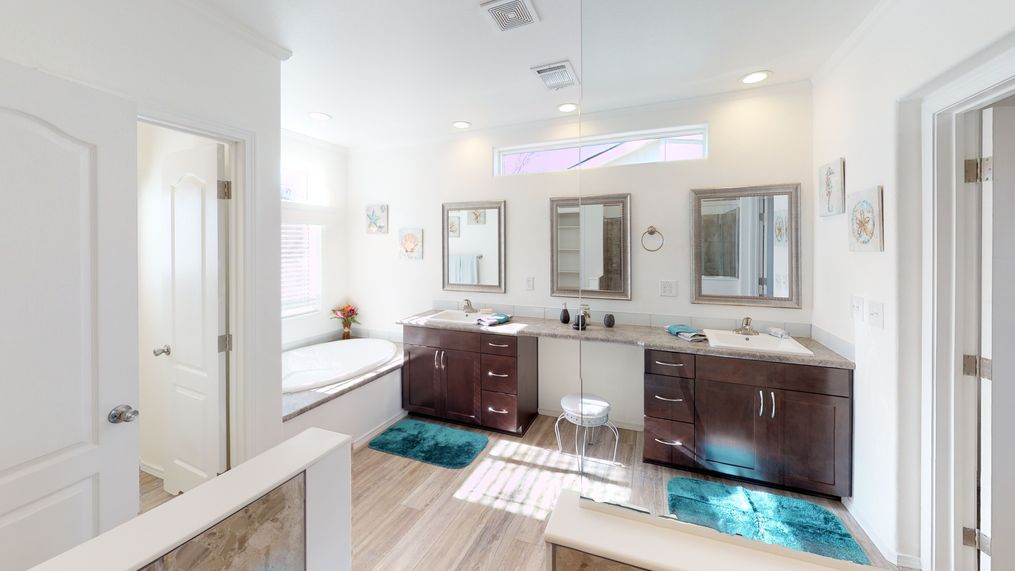 The SUM3068A Primary Bathroom. This Manufactured Mobile Home features 3 bedrooms and 2 baths.