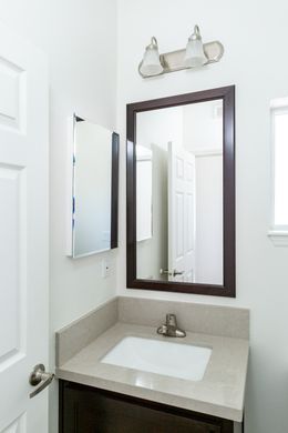 The GLE661K Guest Bathroom. This Manufactured Mobile Home features 3 bedrooms and 2 baths.