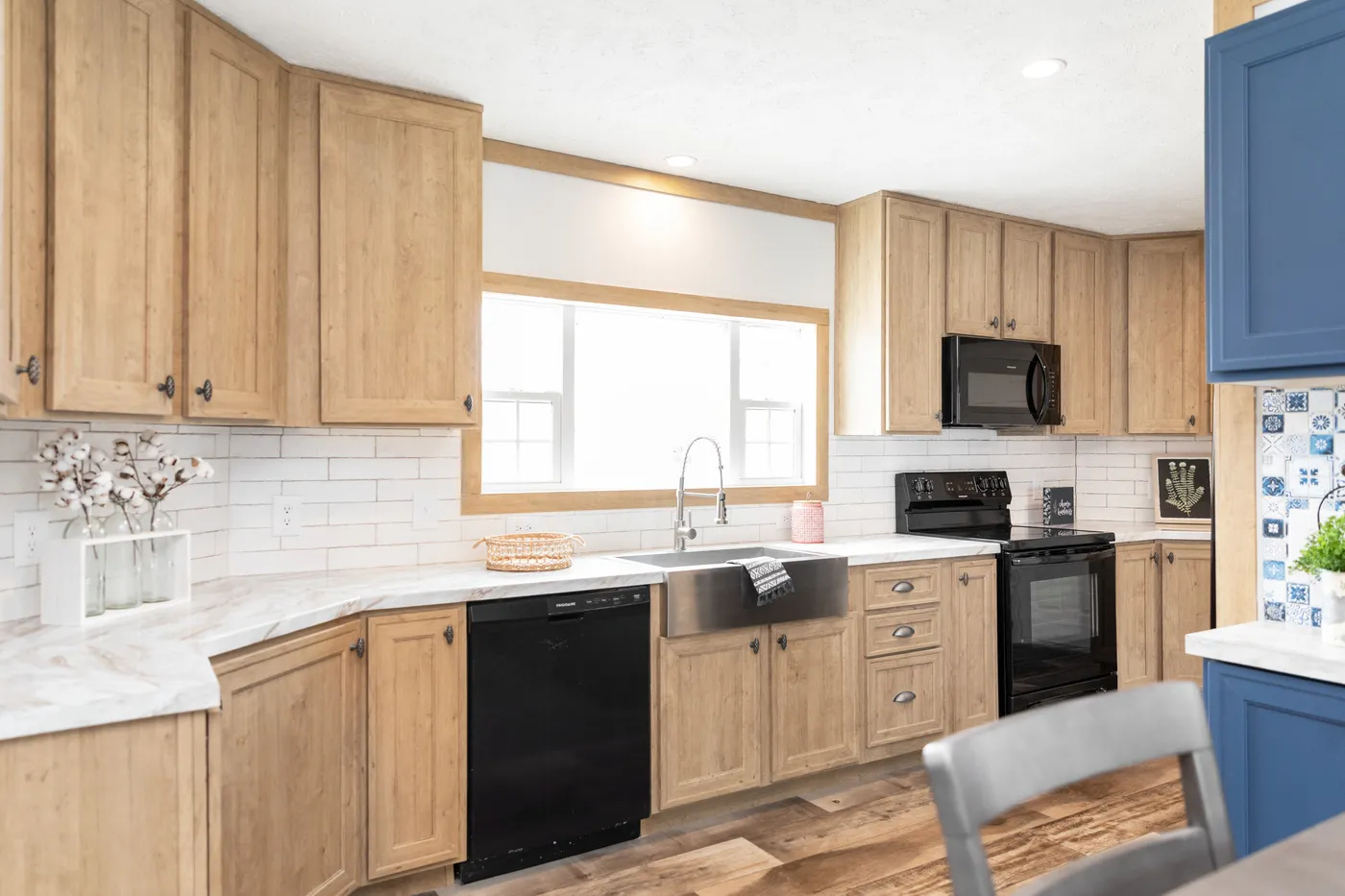 The THE BEXAR Kitchen. This Manufactured Mobile Home features 3 bedrooms and 2 baths.