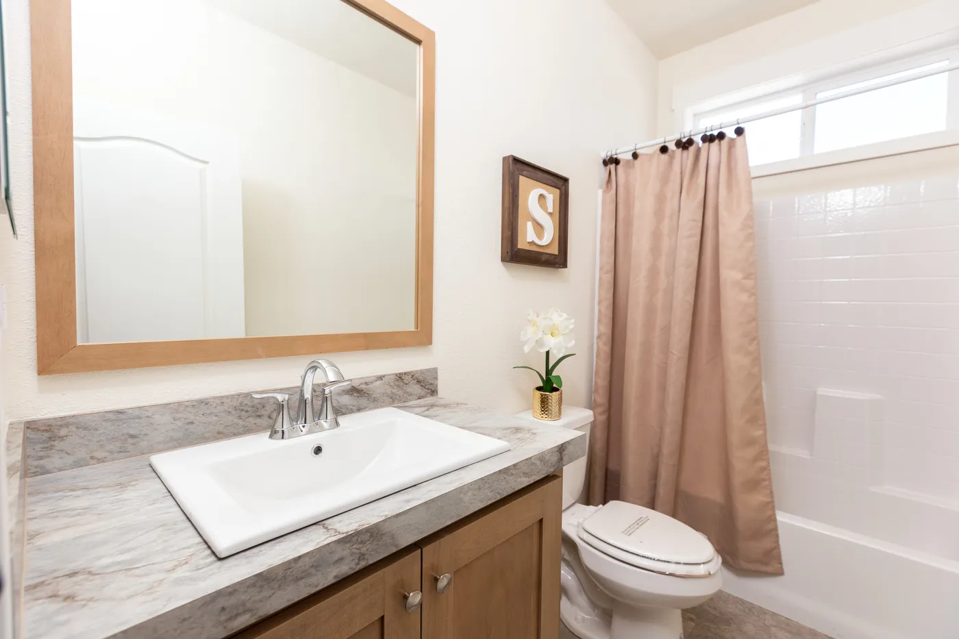The CORONADO 2452G Guest Bathroom. This Manufactured Mobile Home features 3 bedrooms and 2 baths.
