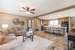 The THE CREEKWOOD Living Room. This Manufactured Mobile Home features 4 bedrooms and 2 baths.