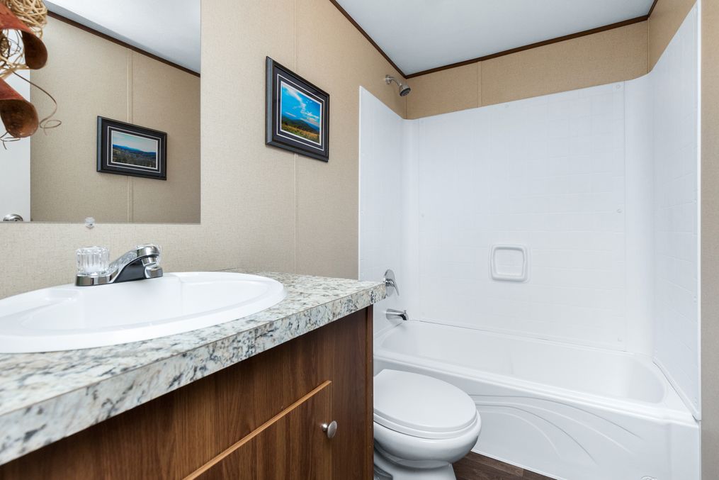 The VICTORY PLUS Guest Bathroom. This Manufactured Mobile Home features 3 bedrooms and 2 baths.