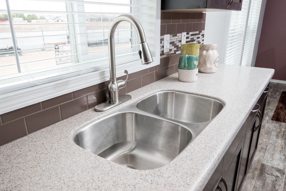 The ENCHANTMENT 3070A Kitchen. This Manufactured Mobile Home features 3 bedrooms and 2 baths.