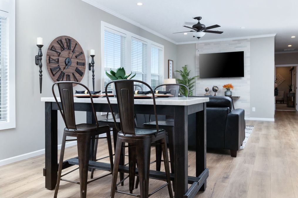 The THE LANEY Dining Area. This Manufactured Mobile Home features 3 bedrooms and 3 baths.