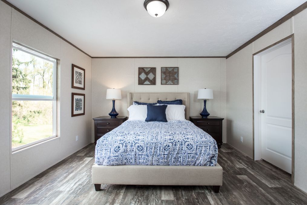 The THE BREEZE 2.5         CLAYTON Primary Bedroom. This Manufactured Mobile Home features 4 bedrooms and 2 baths.