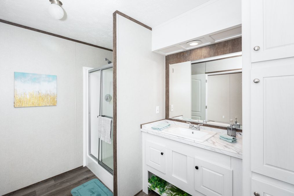 The BLAZER 76 P Primary Bathroom. This Manufactured Mobile Home features 3 bedrooms and 2 baths.