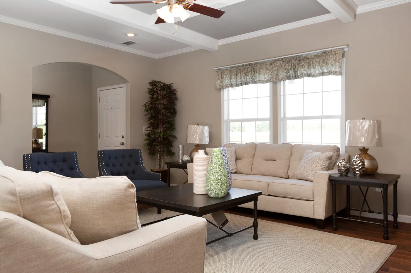 The NORMANDY Living Room. This Manufactured Mobile Home features 3 bedrooms and 2 baths.