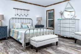 The THE LIZA JANE Primary Bedroom. This Manufactured Mobile Home features 3 bedrooms and 2 baths.