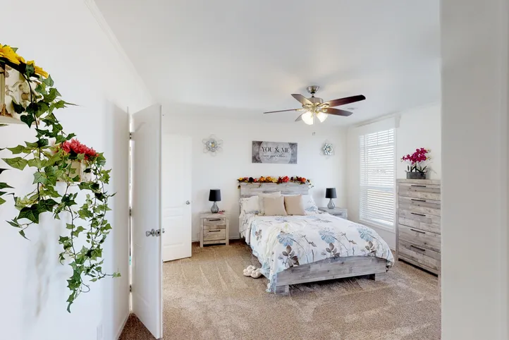 The SUM3068A Primary Bedroom. This Manufactured Mobile Home features 3 bedrooms and 2 baths.