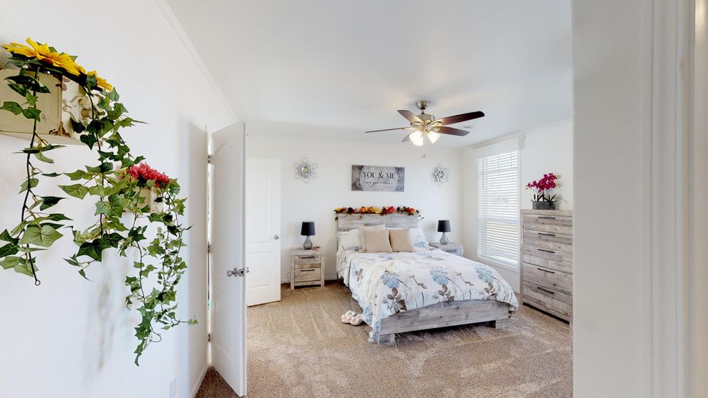 The SUM3068A Primary Bedroom. This Manufactured Mobile Home features 3 bedrooms and 2 baths.