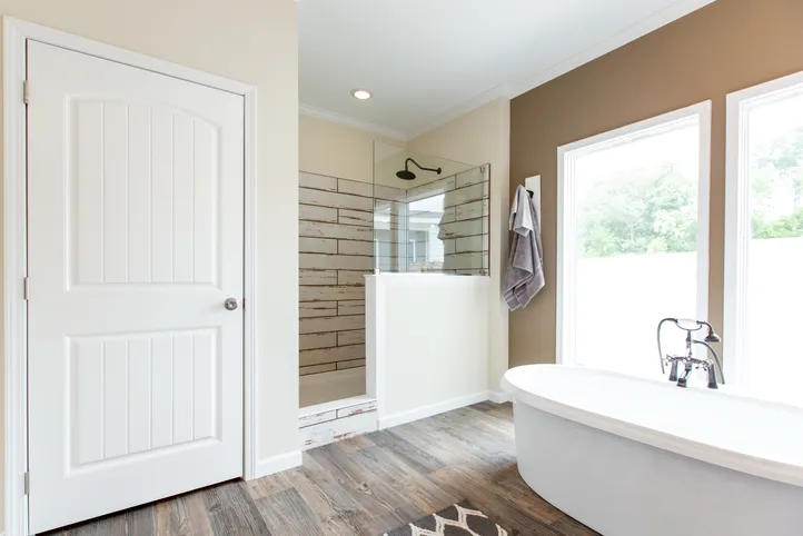 The SOUTHERN CHARM Primary Bathroom. This Manufactured Mobile Home features 3 bedrooms and 2 baths.