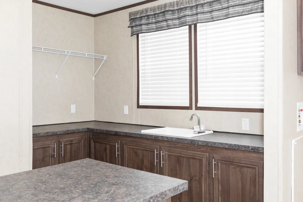 The THE RIVERWAY Utility Room. This Manufactured Mobile Home features 4 bedrooms and 2 baths.
