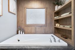 The FARMHOUSE 3 Guest Bathroom. This Manufactured Mobile Home features 3 bedrooms and 2 baths.